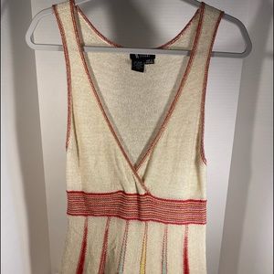 Beautiful long tank. This is a size L. Great for a night out!